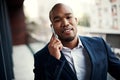 Success requires one to be mobile. Portrait of a handsome young businessman talking on a cellphone outside his office. Royalty Free Stock Photo