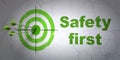 Security concept: target and Safety First on wall background Royalty Free Stock Photo