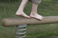 Boy legs on a balance beam. Go ahead. Success steps.