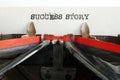 Success story is shown using the text in the typewriter Royalty Free Stock Photo