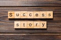 Success story word written on wood block. Success story text on table, concept Royalty Free Stock Photo