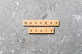 Success story word written on wood block. Success story text on table, concept Royalty Free Stock Photo