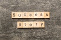 Success story word written on wood block. Success story text on table, concept Royalty Free Stock Photo