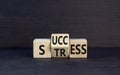 Success or stress symbol. Concept word Success Stress on wooden cubes. Beautiful black table black background. Business and Royalty Free Stock Photo