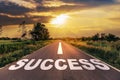 Success text on the highway road concept for planning and challenge or career path, business strategy in sunset background Royalty Free Stock Photo