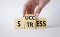 Success vs Stress symbol. Businessman hand turns wooden cubes and changes the word Stress to Success. Beautiful white background. Royalty Free Stock Photo