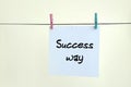 Success way. Note is written on a white sticker that hangs with Royalty Free Stock Photo