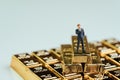 Success wealth management concept, miniature figure businessman Royalty Free Stock Photo