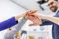 Crop of happy business team celebrating victory in office. Royalty Free Stock Photo