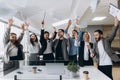 Success and winning concept - happy business team celebrating victory in office Royalty Free Stock Photo