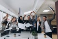 Success and winning concept - happy business team celebrating victory in office Royalty Free Stock Photo