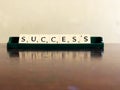Success word written on scrabble blocks for content creation