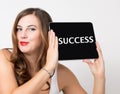 Success written on virtual screen. technology, internet and networking concept. beautiful woman with bare shoulders Royalty Free Stock Photo