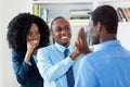 Successful african american business team gives high five Royalty Free Stock Photo