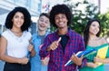 Successful african american hipster student with group of international students Royalty Free Stock Photo
