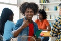 Successful african american male college student at desk at classroom Royalty Free Stock Photo