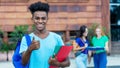 Successful african american male student showing thumb up with group of international students Royalty Free Stock Photo