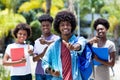 Successful african american university student with group of african american students Royalty Free Stock Photo