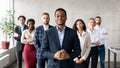 Successful African Businessman Standing With His Business Team In Office Royalty Free Stock Photo