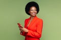 Successful african businesswoman with smartphone look aside with confident happy smile isolated Royalty Free Stock Photo