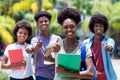 Successful african female student with group of african american students Royalty Free Stock Photo