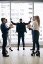 Successful ambitious businessman celebrating a triumph with arms up Royalty Free Stock Photo