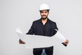 Successful indian Architect pointing with blueprint on white background Royalty Free Stock Photo