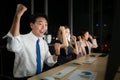 Successful asian business people celebrating success in office at night, Royalty Free Stock Photo