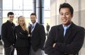 Successful asian businessman leading business team
