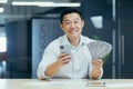 Successful asian businessman working in office, man smiling and looking at camera Royalty Free Stock Photo