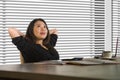 Successful Asian Chinese business woman working confident at modern office computer desk in female businesswoman job smiling chee Royalty Free Stock Photo