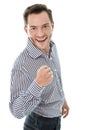 Successful attractive young business man holding fist up isolate Royalty Free Stock Photo