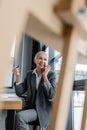 successful banker smiling during conversation on Royalty Free Stock Photo