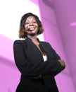 Successful black African American business woman with headset speaking in auditorium at corporate training event or seminar giving Royalty Free Stock Photo