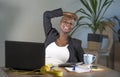 Successful black afro American business woman working at modern office smiling cheerful leaning relaxed on chair Royalty Free Stock Photo