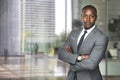 Successful black business man ceo downtown workspace proud confident arms crossed Royalty Free Stock Photo