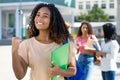 Successful black female student with group of latin american and caucasian young adults Royalty Free Stock Photo