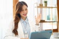 Successful business concept, Businesswoman doing greeting gesture with colleague on video call