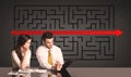 Business couple with a solved puzzle in background Royalty Free Stock Photo