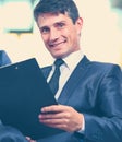 Successful business man in background at office Royalty Free Stock Photo