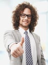 Successful business man gives you a thumbs up Royalty Free Stock Photo