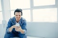 Successful business man sitting in a cafe with phone Royalty Free Stock Photo