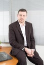 business man sitting in desk office portrait of businessman looking at camera Royalty Free Stock Photo