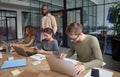 Successful business people. Group of young multiracial people, coworkers working together in modern office, using Royalty Free Stock Photo