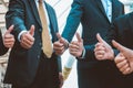 Successful business people with thumbs up and smiling, business Royalty Free Stock Photo