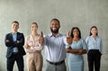 Successful Business Team. Black Male Ceo Posing With Smiliing Employees In Office Royalty Free Stock Photo