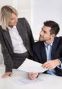 Successful business team: Female boss talking with her colleague Royalty Free Stock Photo