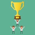 Successful business team holding trophy. Teamwork concept. Royalty Free Stock Photo