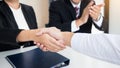 successful business team shaking hands with eachother in the off Royalty Free Stock Photo