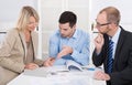 Successful business team sitting around a table in a meeting. Royalty Free Stock Photo